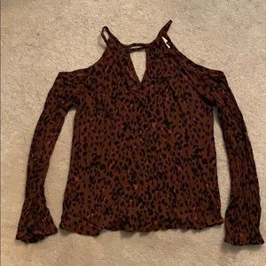 Open shoulder long sleeve shirt.